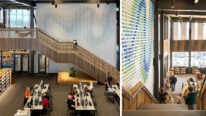 Photo of staircase and wall graphic at Moorhead Public Library. In the foreground, people are working at computers.