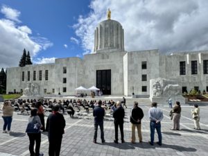 A crowd gathers in the new Oregon State Capitol entry plaza for a dedication event
